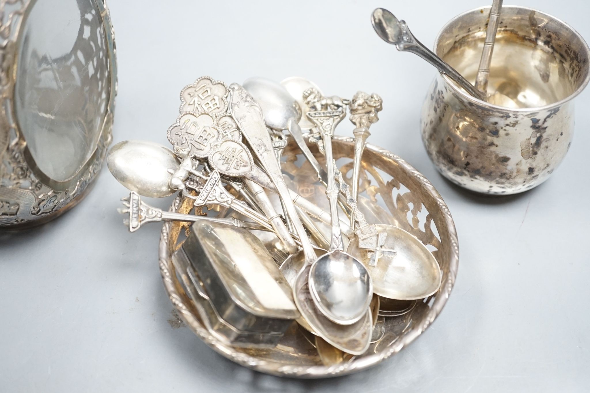 A Chinese white metal overlaid glass dimpled decanter and stopper, 19.1cm, a 900 small vase, a pierced silver bowl and a group of assorted Chinese and other white metal spoons.